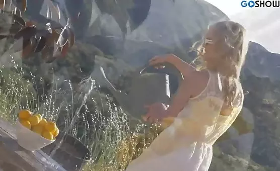 The alluring blonde sizzles in summer heat